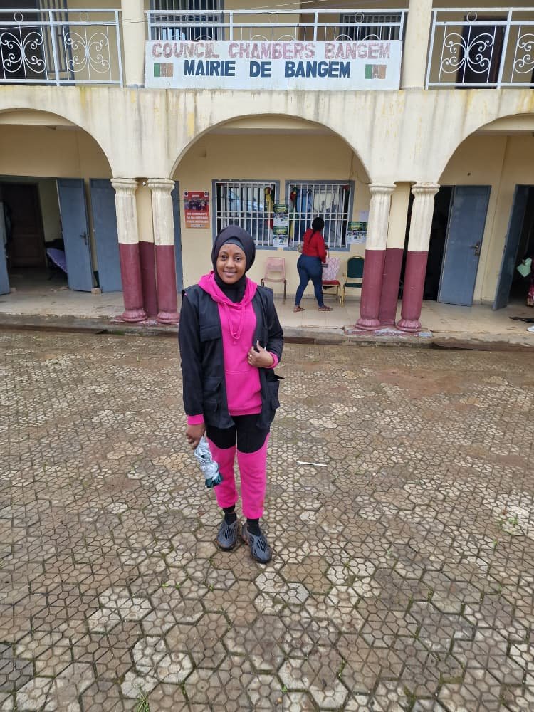A representative stands outside a council building during a stakeholder visit.
